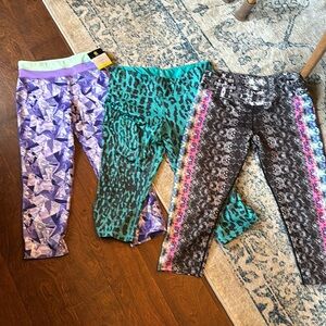 Bundle of three pairs of capri length leggings. Size medium.
